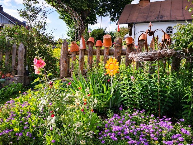 Cottage garden with colorful flowers at a house